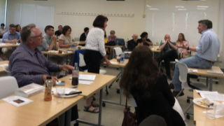 2022 Summer Seminar with faculty and administrators sitting together in a classroom. 