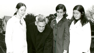 a photo of Monsignor Thomas Fahy breaking ground for the Woman’s Dorm