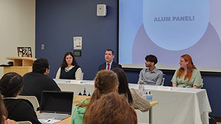 Panel of commarts graduate students giving advice to a small crowd. 