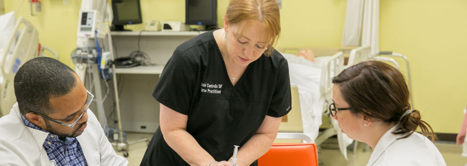 Faculty member with nursing students.