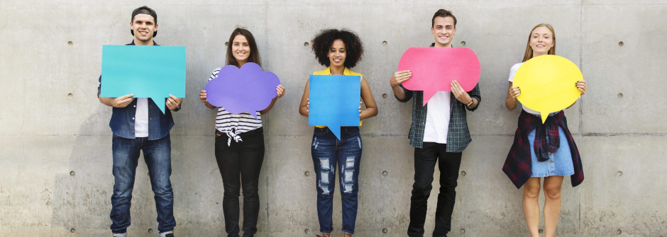 A group of students with colorful posters