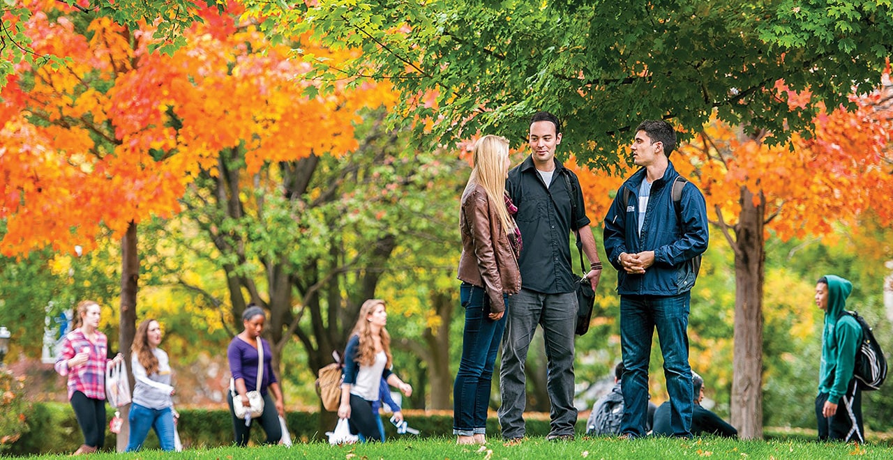 A photo of students standing on the University Green on the Seton Hall campus.