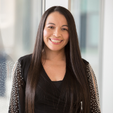 Image of Claudia Veronica Freire in front of a big window.