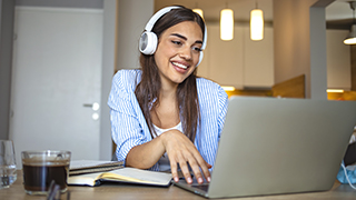 A Young Lady Chatting on a Laptop