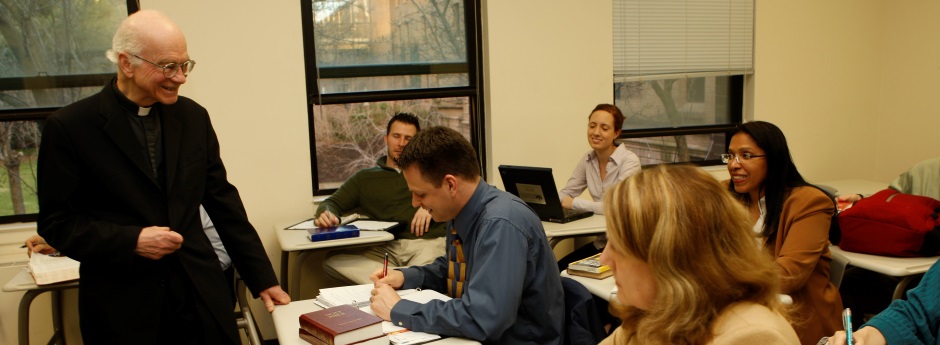 Father Frizzell classroom shot with students