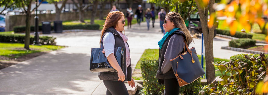 Students talking on campus.