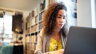Woman studying with laptop