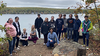 Leadership students and administrators by the lake.