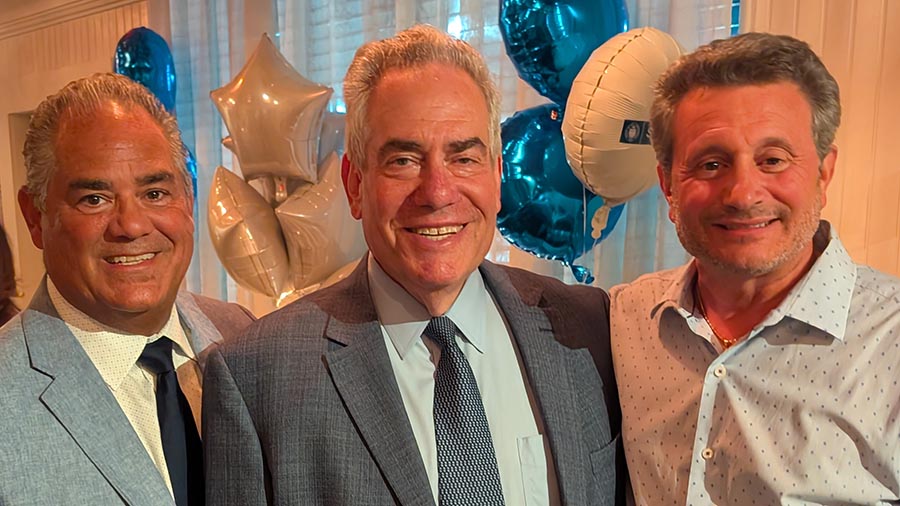 From left to right: Marc Calello ’89, Dean Ronald Weich, and John Chiaia ’93