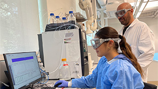 Dr. Antonacci and Daniella working in the lab.