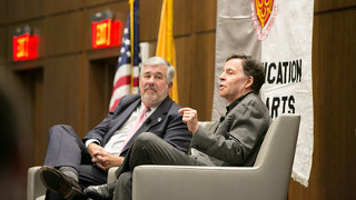 Bob Ley and Bob Costas speaking on stage. 