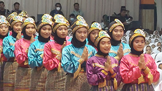 Students at the NU boarding school performing for the delegates.