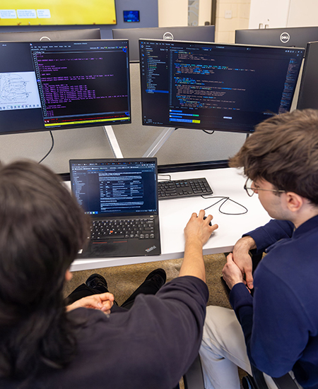 Two students in the Cybersecurity Lab.