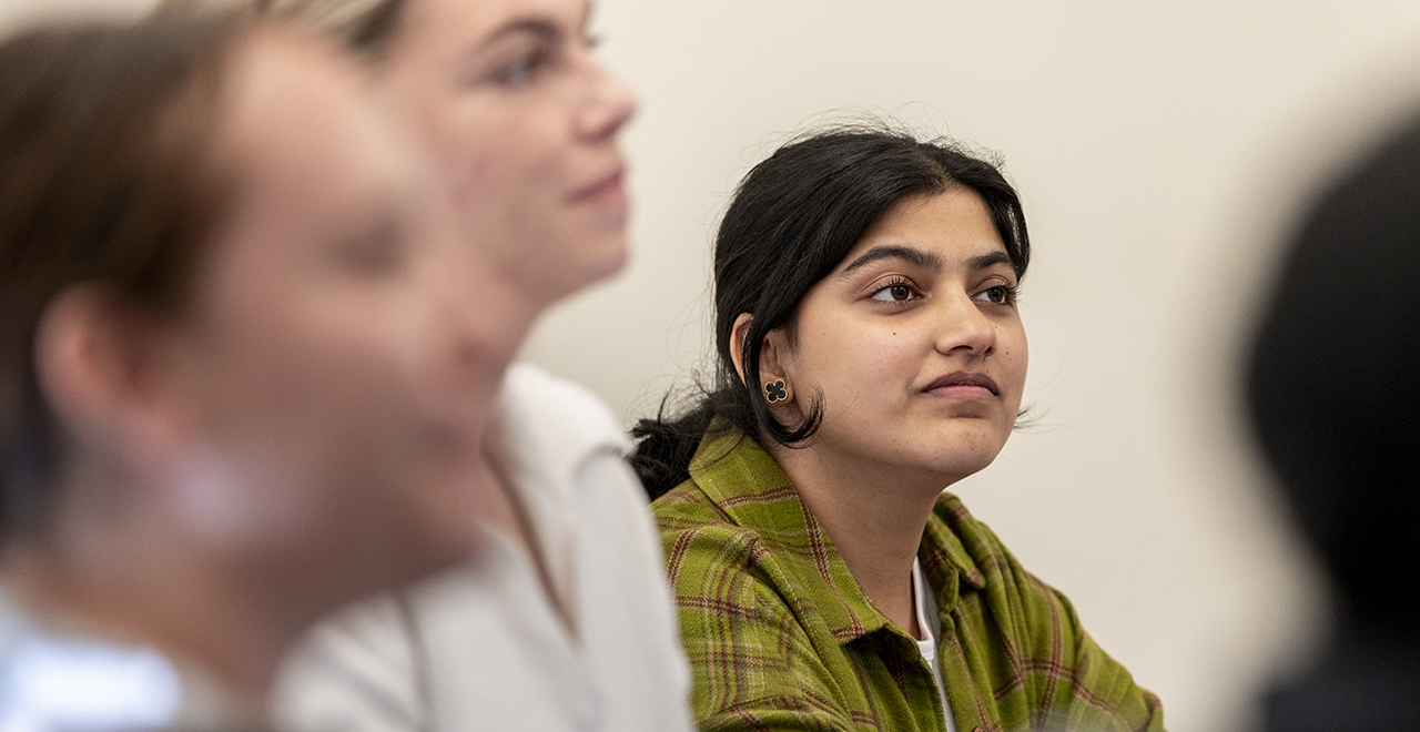 A diplomacy student listening in class.
