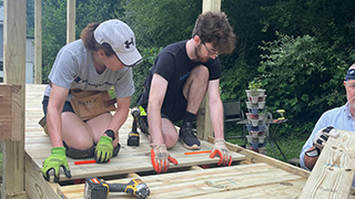 Appalachia volunteers building a mobility ramp