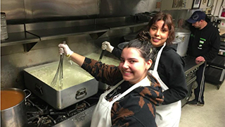 DOVE student volunteers serving at St. John's breakfast shift