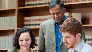 Faculy member with students 