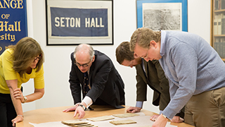 Faculty members doing research Faculty members doing research in the University archives