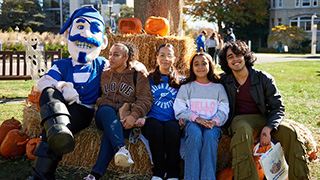 family taking picture with pirate 