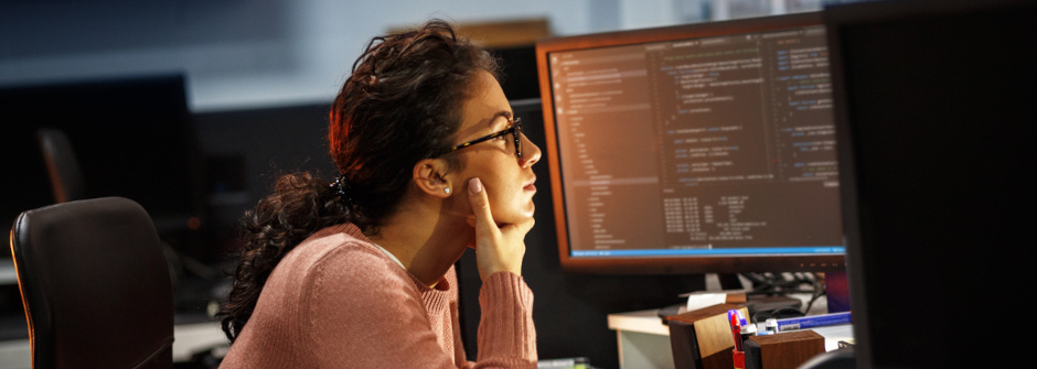 A student working at a computer station.