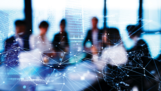 Business professionals around a conference table with a graphic overlay.