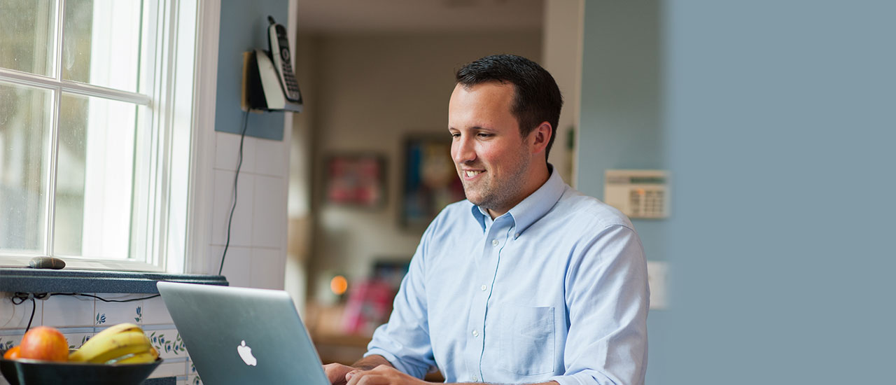 Web Designer looking at laptop