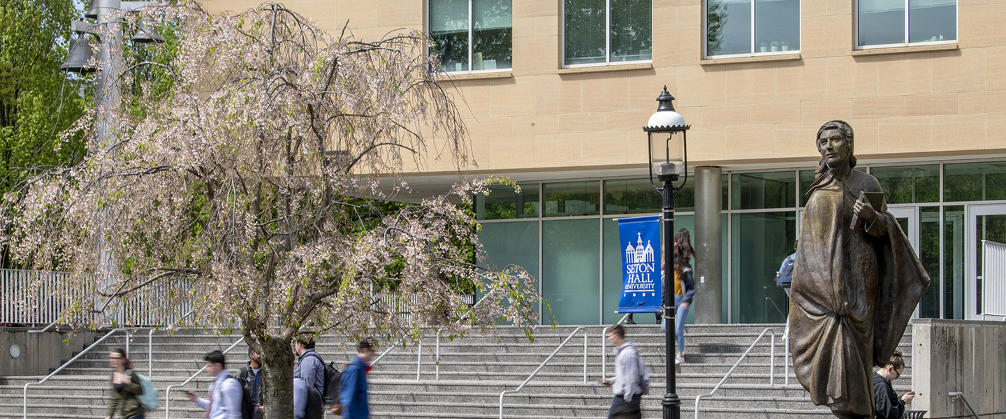 A photo of campus with a statue of Elizabeth Ann Seton.