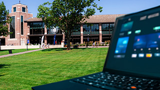 Laptop with Seton Hall University Center in background
