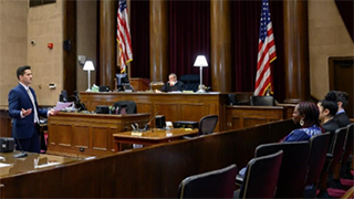 Law student speaking to people