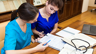 A photo of medical professionals studying together.