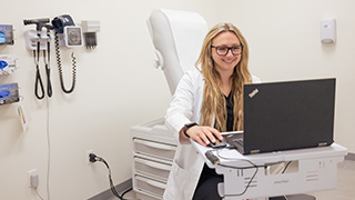 Image of a Nurse on her laptop