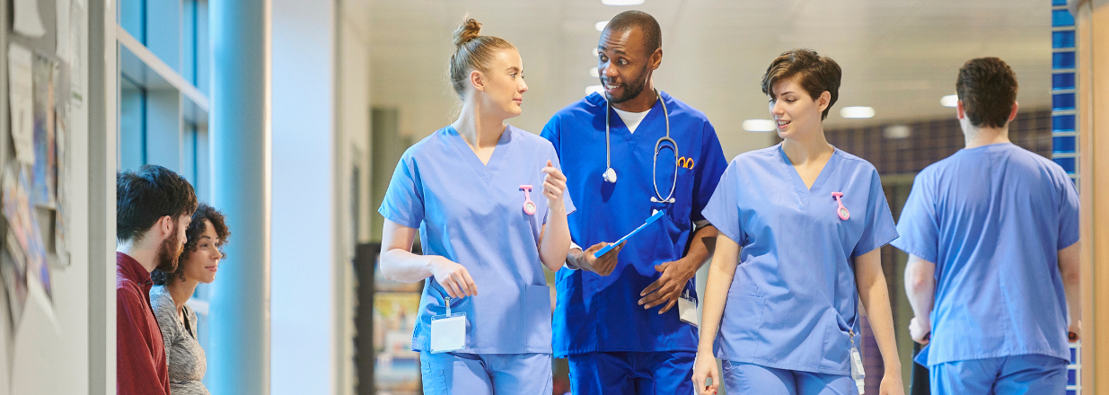 nurses walking down hallway