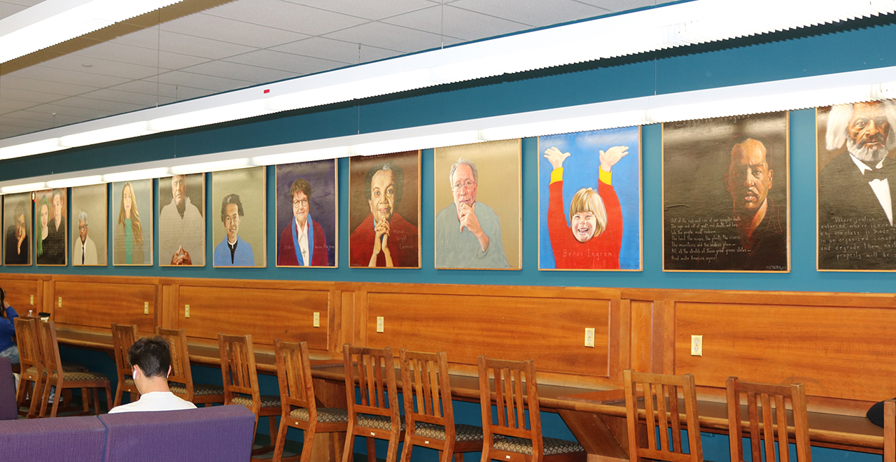 A photo of a painting exhibition in a classroom.