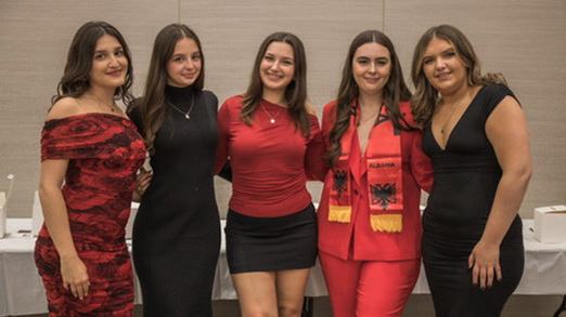 students posing at albanian event 