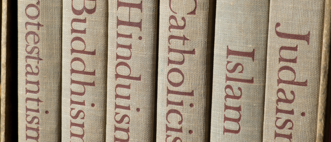 Spines of books on world religions. 