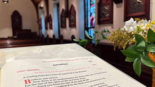 Scripture in chapel with flowers