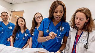 Nursing students practicing clinical skills