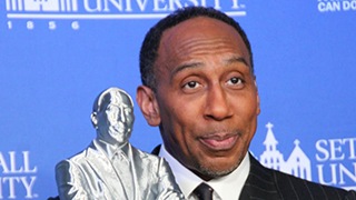 Stephen A. Smith posing with the bust students at Seton Hall created in his likeness | Photo by Christian Hui | The Setonian