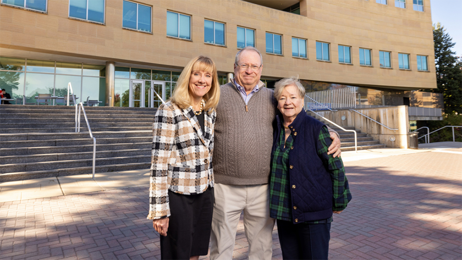 Helen and Robert E. Wright ’67 smile with Dean Joyce Strawser outside of Jubilee Hall