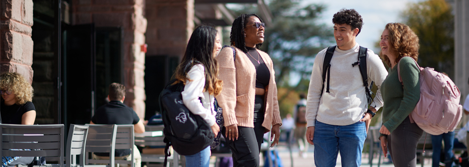 Students talking outside university center. 