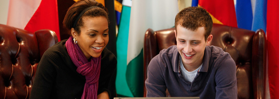 students looking at laptop screen